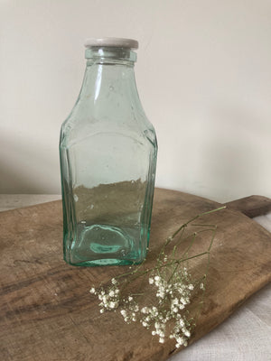 Vintage green glass pickling jar with white lid
