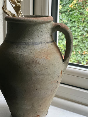 Rustic stoneware pitcher with handle