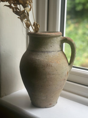 Rustic stoneware pitcher with handle