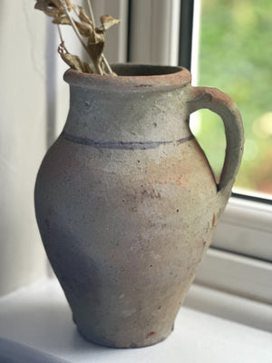 Rustic stoneware pitcher with handle