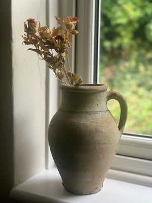 Rustic stoneware pitcher with handle