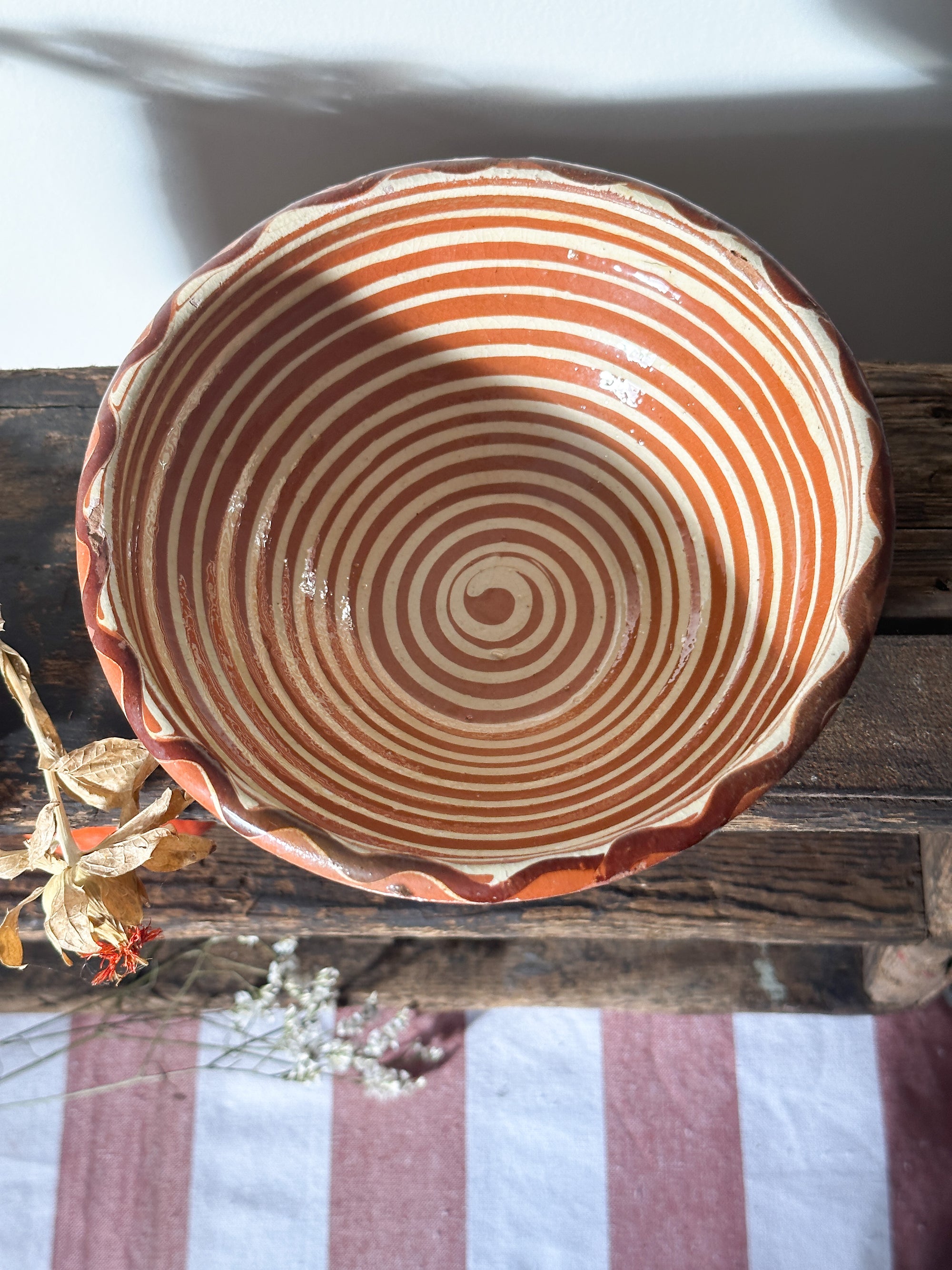 Terracotta bowl cream spiral pattern