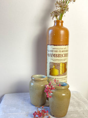 French "eau de vie" brown stoneware bottle with original label